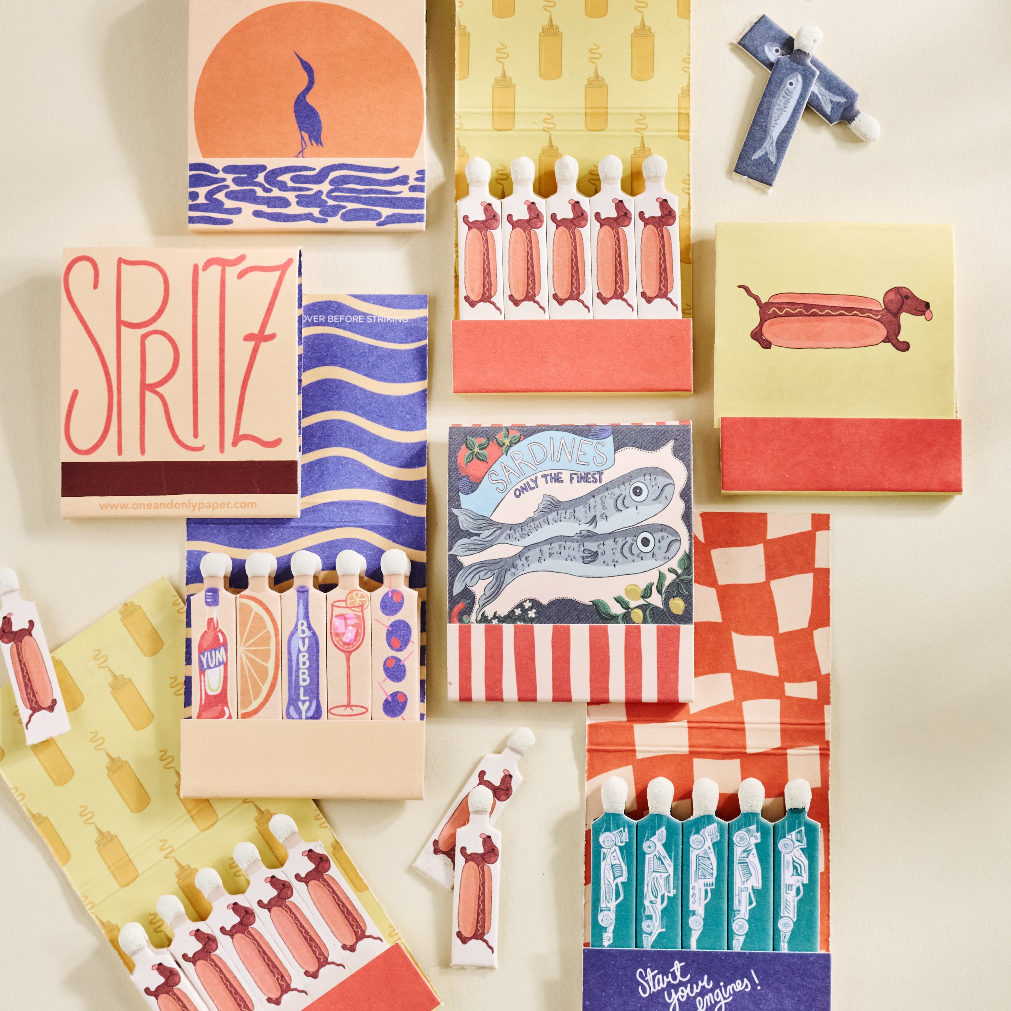 matchbooks sitting on a shelf with a white bust and a disco ball