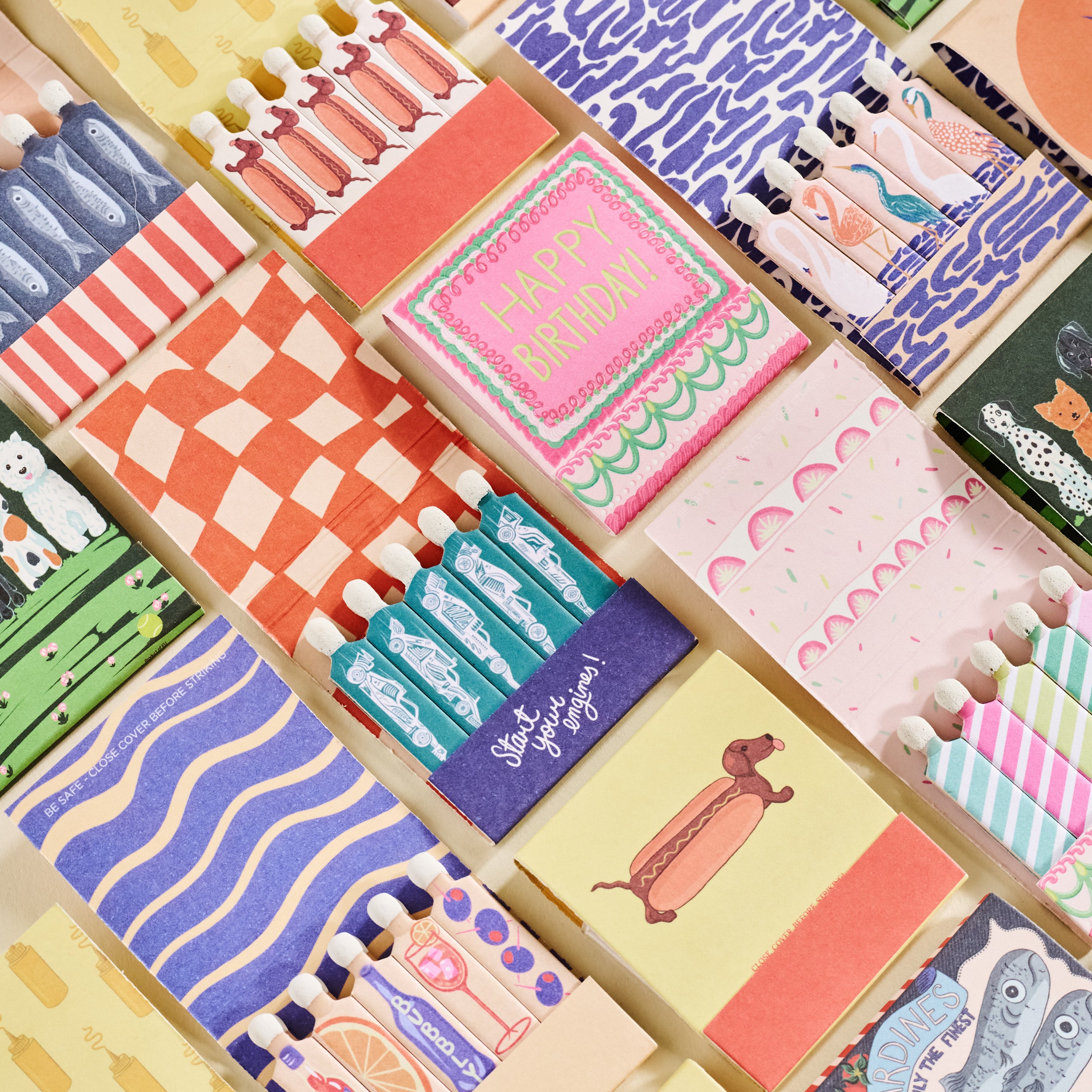 matchbooks sitting on a shelf with a white bust and a disco ball
