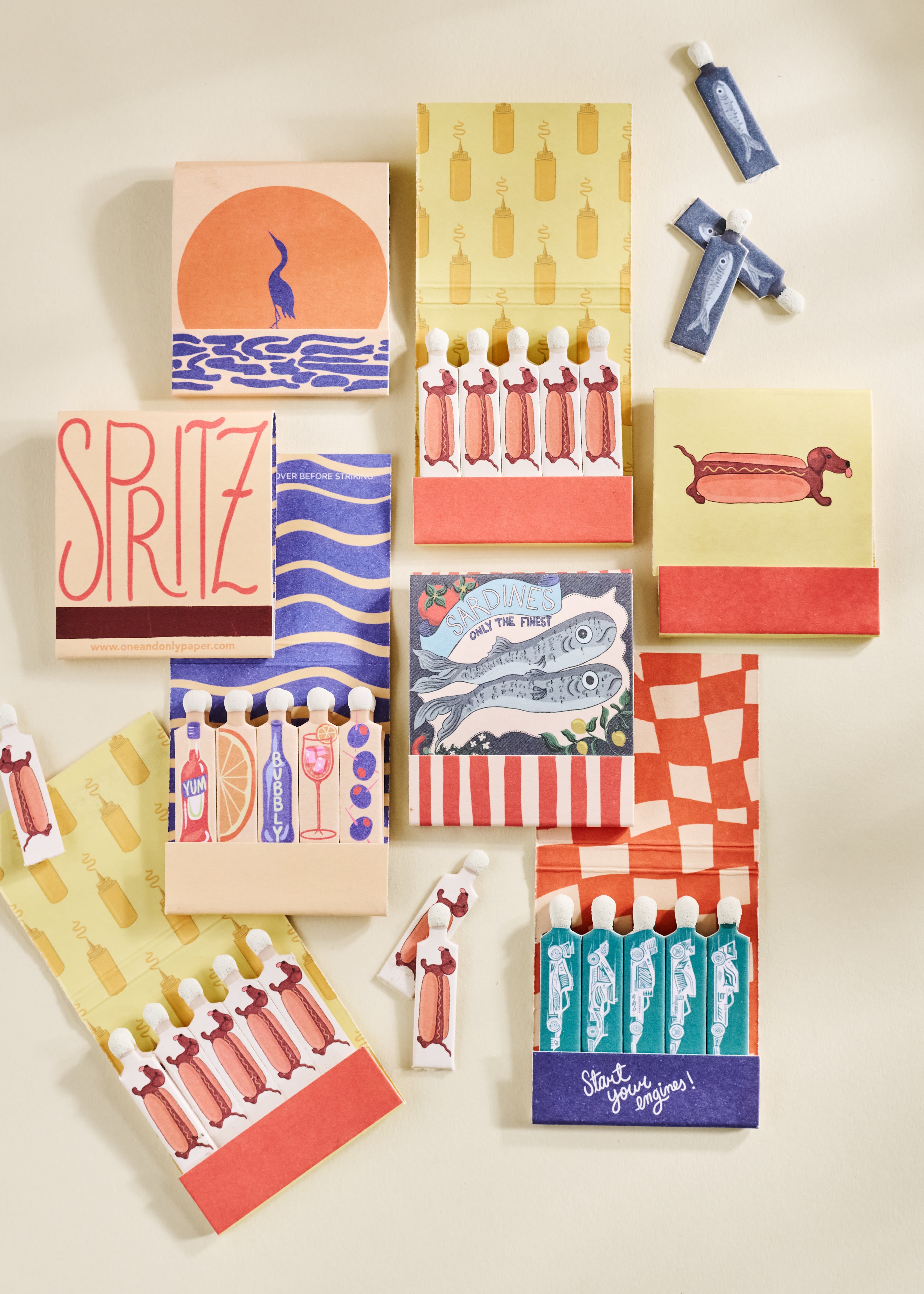 matchbooks sitting on a shelf with a white bust and a disco ball