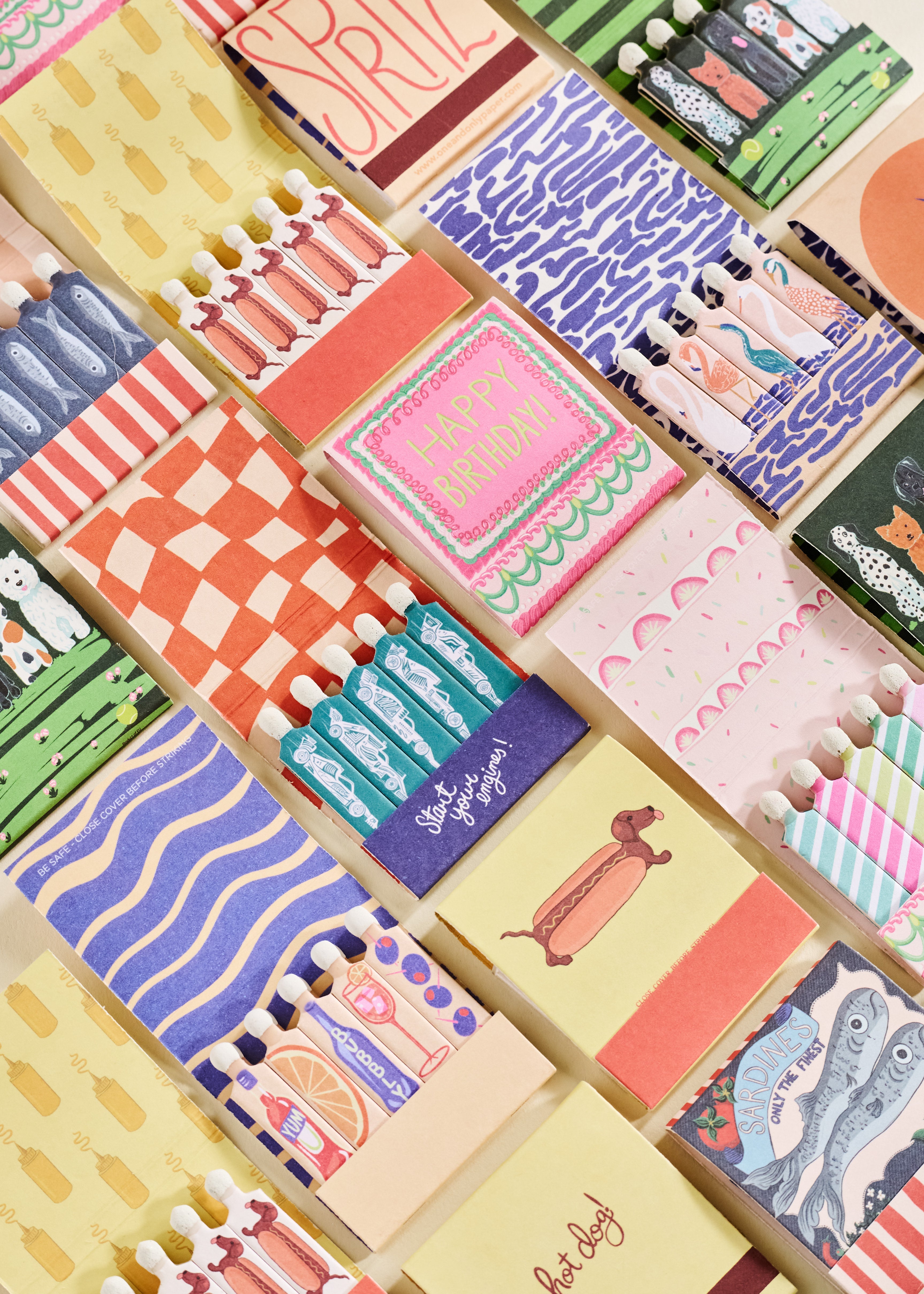matchbooks sitting on a shelf with a white bust and a disco ball