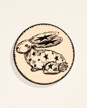 Whimsical star-adorned rabbit illustrated coaster, set of four