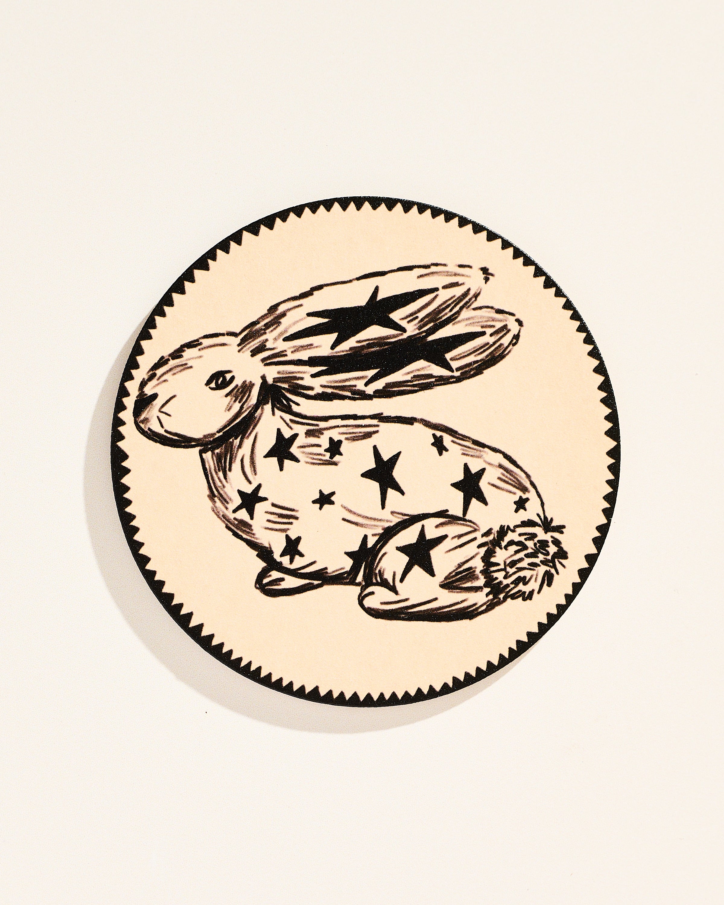 Whimsical star-adorned rabbit illustrated coaster, set of four