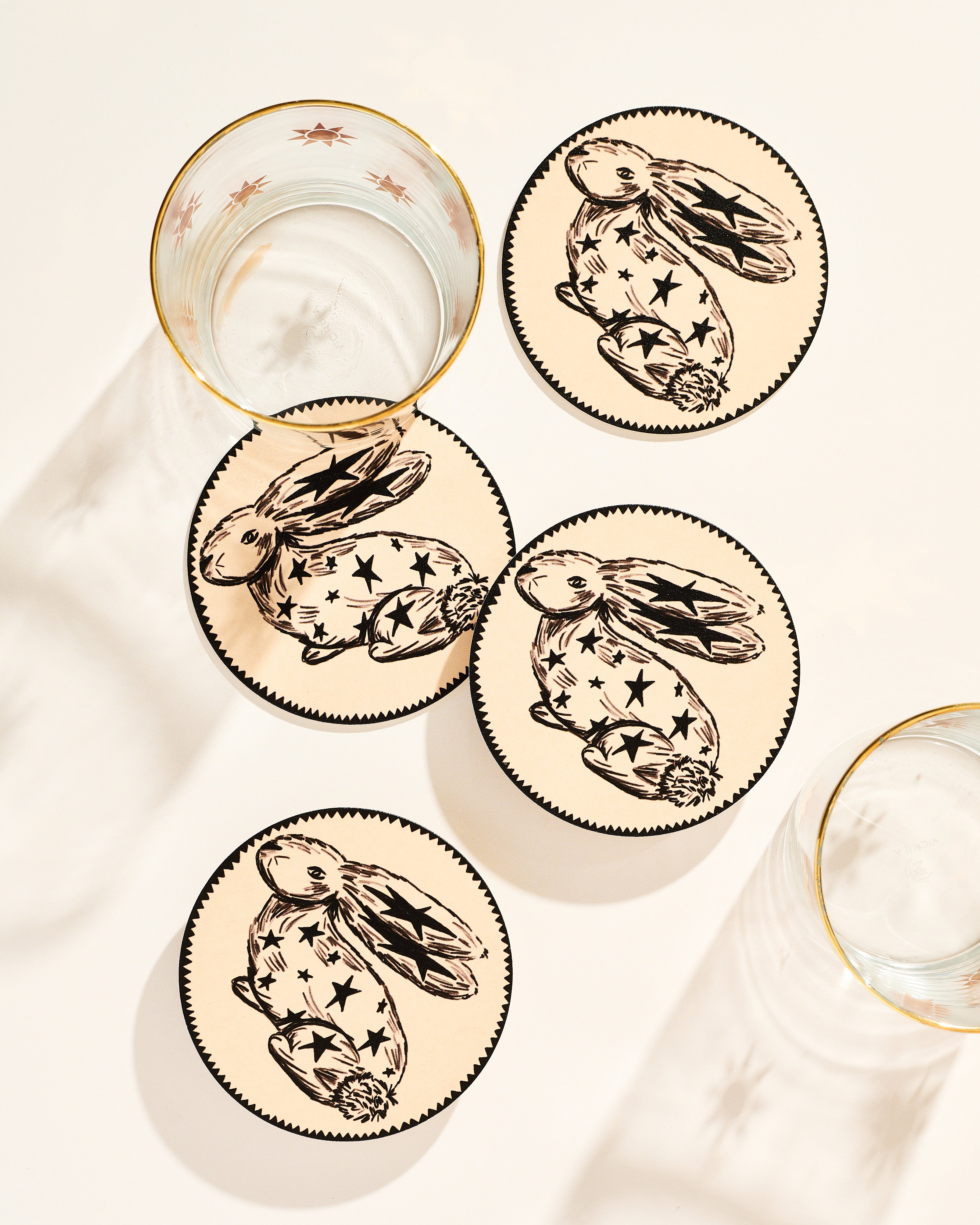 Whimsical star-adorned rabbit illustrated coaster, set of four