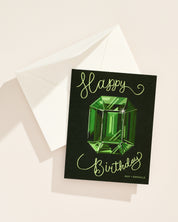 Illustrated May emerald gemstone birthday greeting card