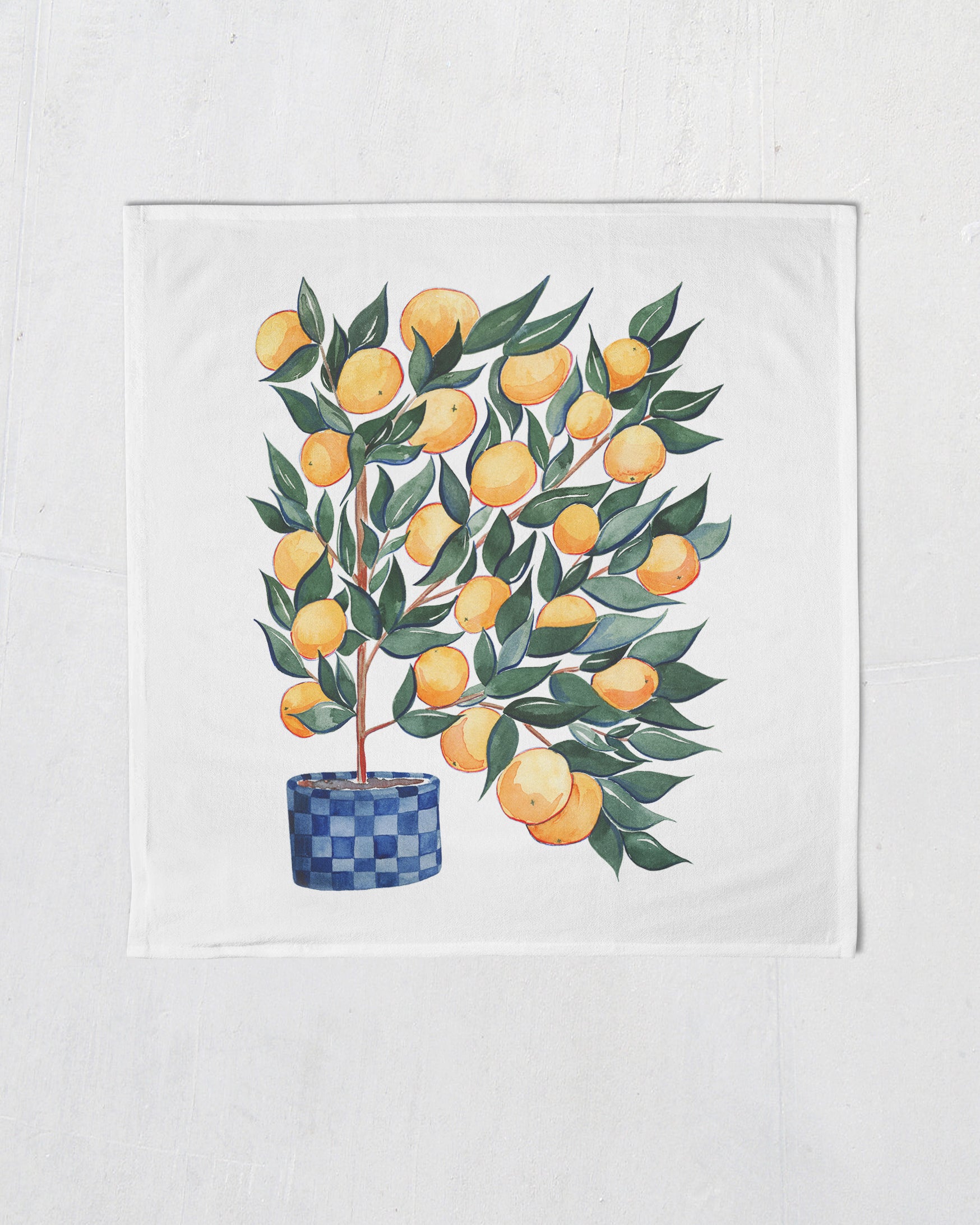 white tea towel with watercolor orange tree in checkered blue pot